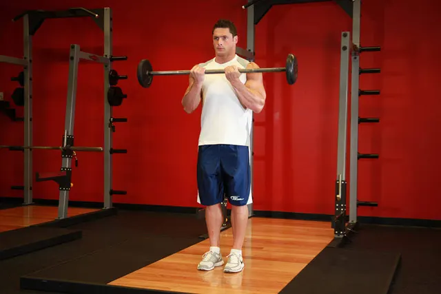 Close-Grip Standing Barbell Curl, finishing position