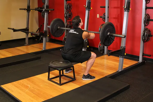 Front Barbell Squat To A Bench, finishing position