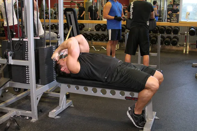 High Cable Curls, finishing position