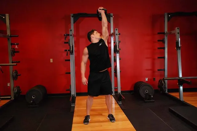 One-Arm Kettlebell Military Press To The Side, finishing position