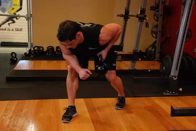 One-Arm Kettlebell Row, finishing position