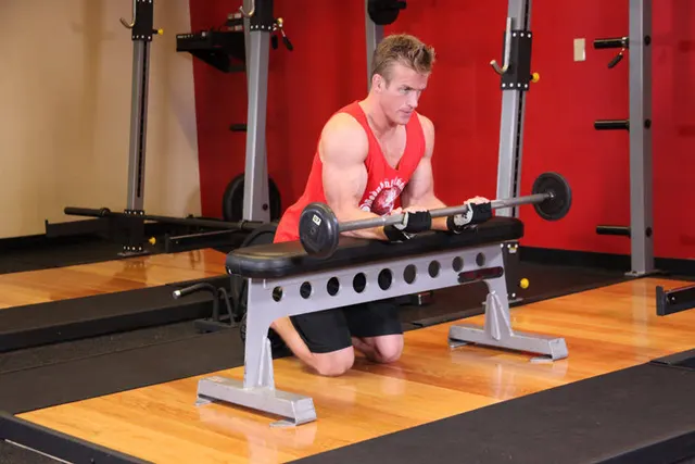 Palms-Up Barbell Wrist Curl Over A Bench, finishing position