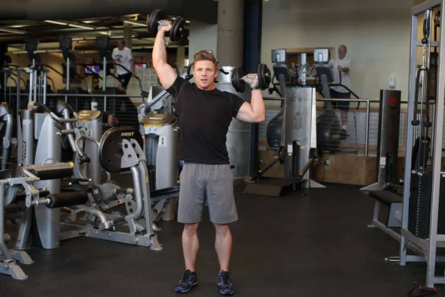 Standing Alternating Dumbbell Press, finishing position