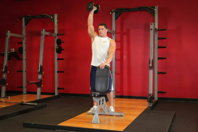 Standing Palm-In One-Arm Dumbbell Press, finishing position
