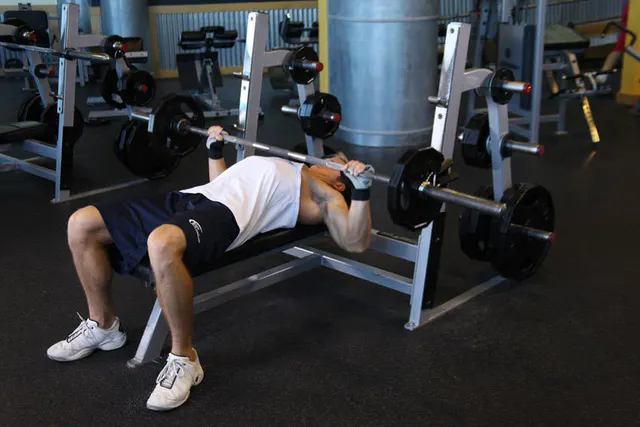 Wide-Grip Barbell Bench Press, finishing position